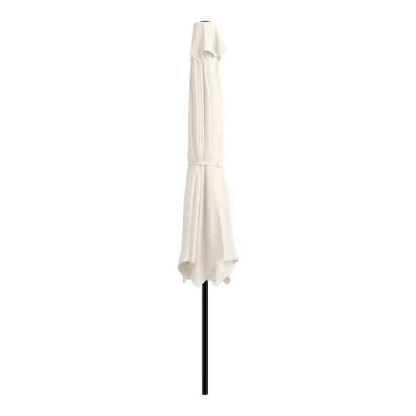 A white umbrella on a black pole.