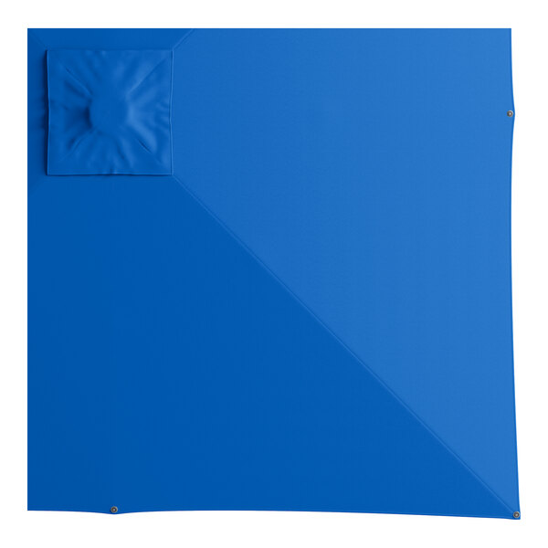 A blue square surface with a square hole and a square object on top.