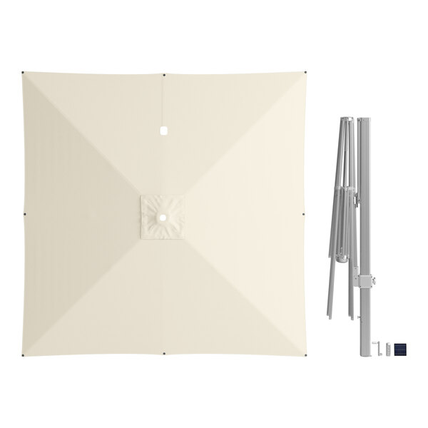 A white Lancaster Table & Seating cantilever umbrella with a metal pole.