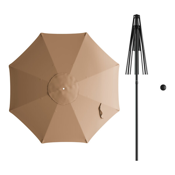 A tan umbrella with a black pole.