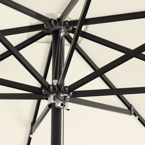 A close up of a black Lancaster Table & Seating square umbrella with a metal pole.