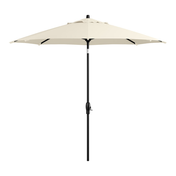 A white umbrella on a black pole.