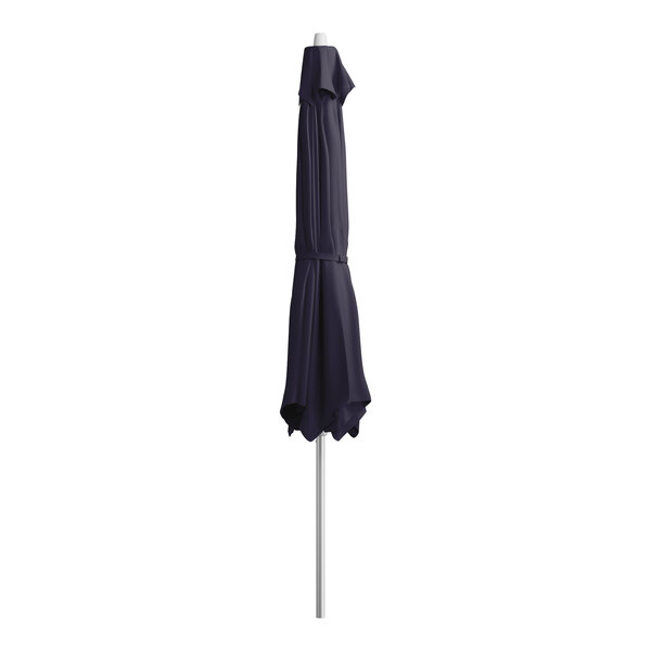 A closed navy blue Lancaster Table & Seating umbrella on a silver metal pole.