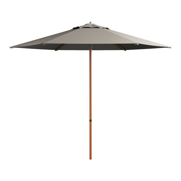 A grey Lancaster Table & Seating umbrella with a woodgrain pole.