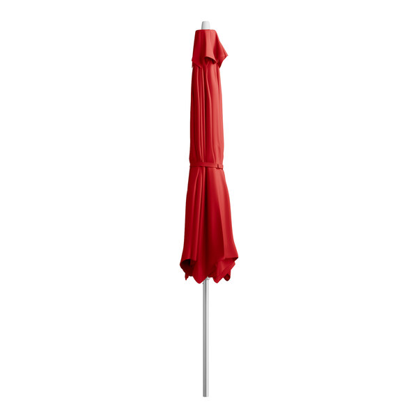 A red Lancaster Table & Seating umbrella on a silver metal pole.