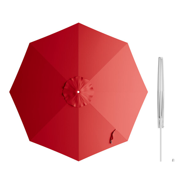 A red umbrella with a silver metal pole and crank lift.