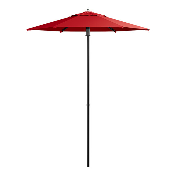 A red umbrella on a black pole.