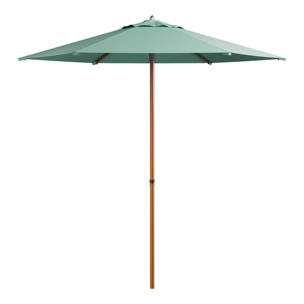 A green umbrella with a wooden pole.