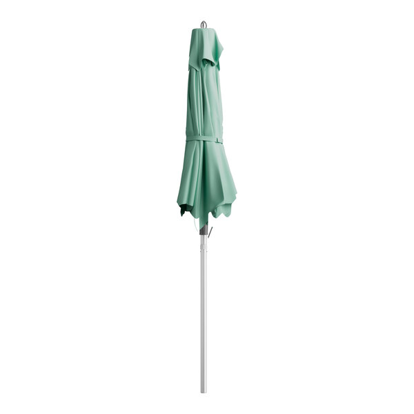 A green Lancaster Table & Seating umbrella on a pole.