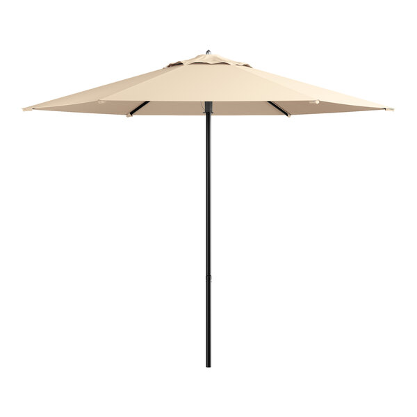 A large beige umbrella on a pole.