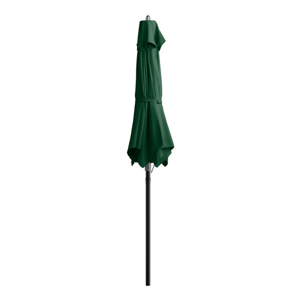 A forest green Lancaster Table & Seating umbrella on a black pole.