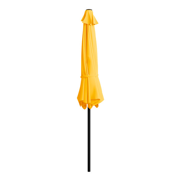 A yellow umbrella on a black pole.