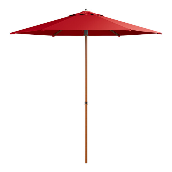 A red umbrella with a woodgrain pole.