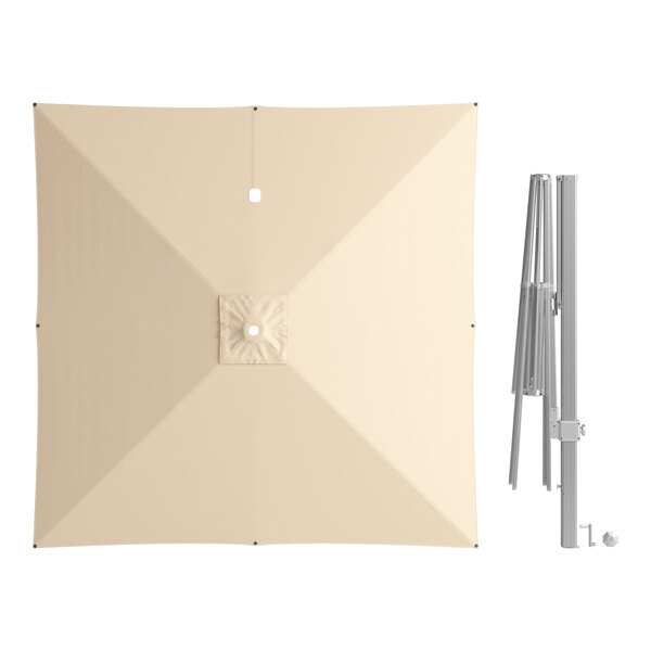 A white square Lancaster Table & Seating umbrella with a metal pole and a hole in the center.