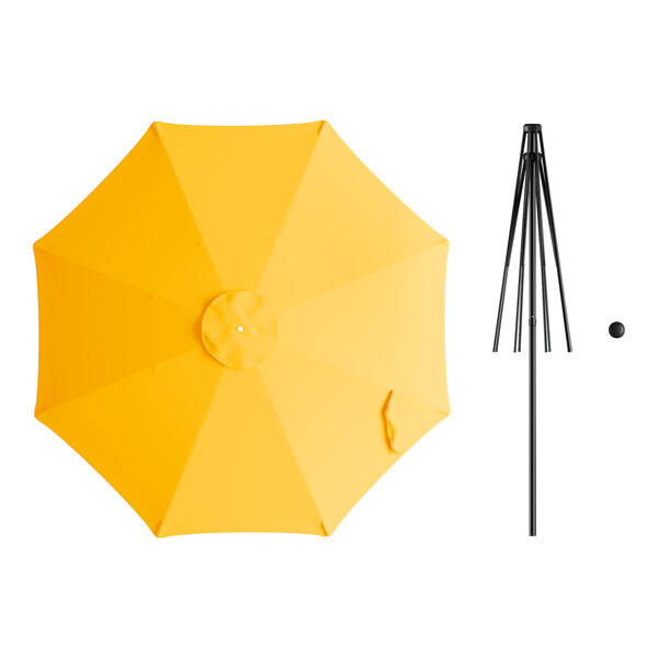 A yellow umbrella with a black pole and a hole in the top.