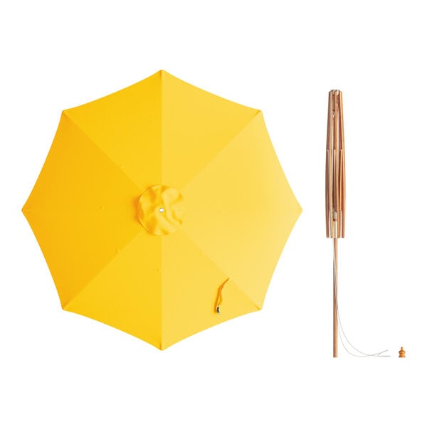 A Lancaster Table & Seating round yellow umbrella with a wooden pole.