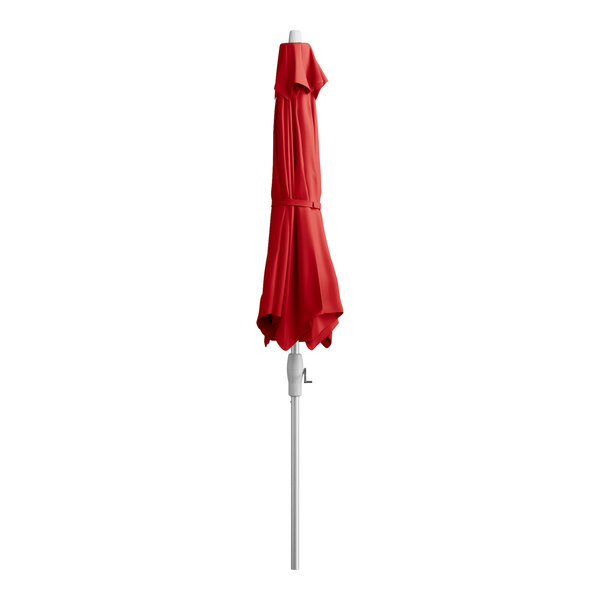 A red Lancaster Table & Seating umbrella on a silver metal pole.