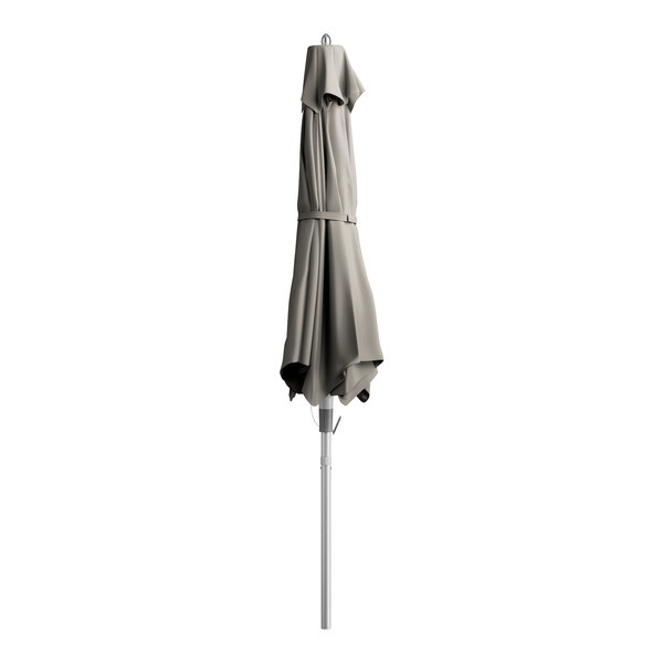 A closed Lancaster Table & Seating graphite umbrella on a pole.
