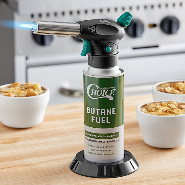 A green Choice butane canister in a black base with a gas burner.