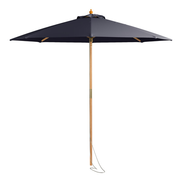 A Lancaster Table & Seating indigo blue bamboo umbrella with a wooden pole and pulley system.