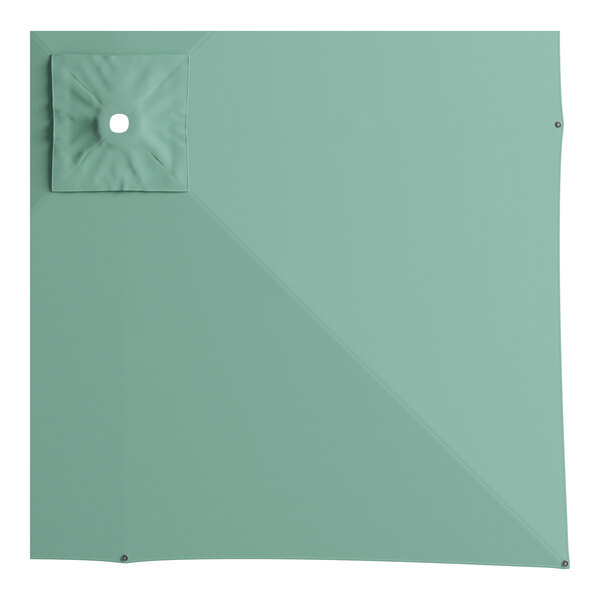 A square green umbrella with a white center.