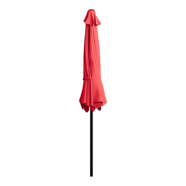 A red umbrella on a black pole.