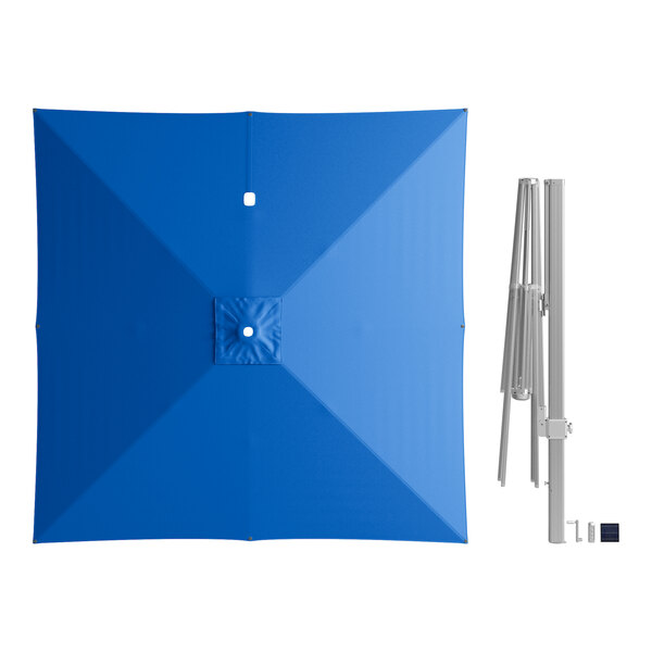 A Lancaster Table & Seating blue square umbrella with a white pole.