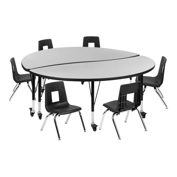 A Flash Furniture round gray laminate table with a black base and wheels with black chairs.