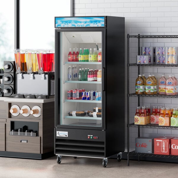 An Avantco glass door merchandiser refrigerator with shelves full of beverages.