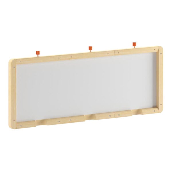 A white board with a wooden frame.