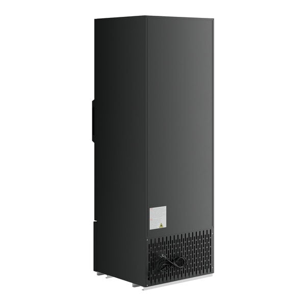 A black rectangular object with a white label and a black cord plugged into it.