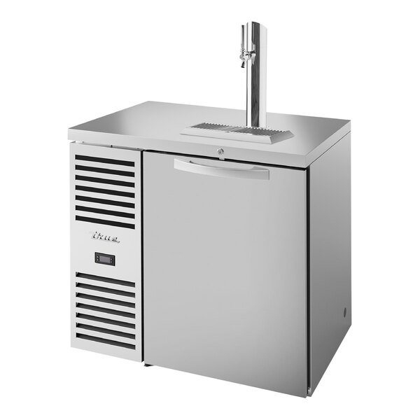 A stainless steel True beer dispenser with a tap.