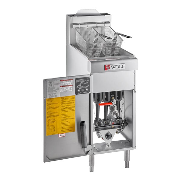 A Wolf natural gas floor fryer with a basket inside.