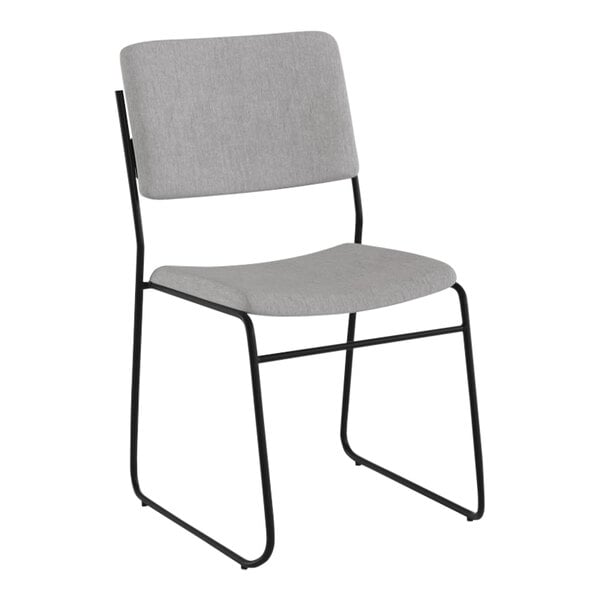 A gray Flash Furniture stacking chair with black legs.