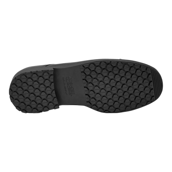 A black Shoes For Crews Senator dress shoe with a black rubber sole.