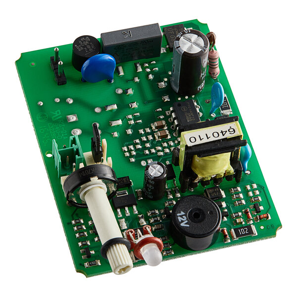 A green circuit board with many small electronic components.
