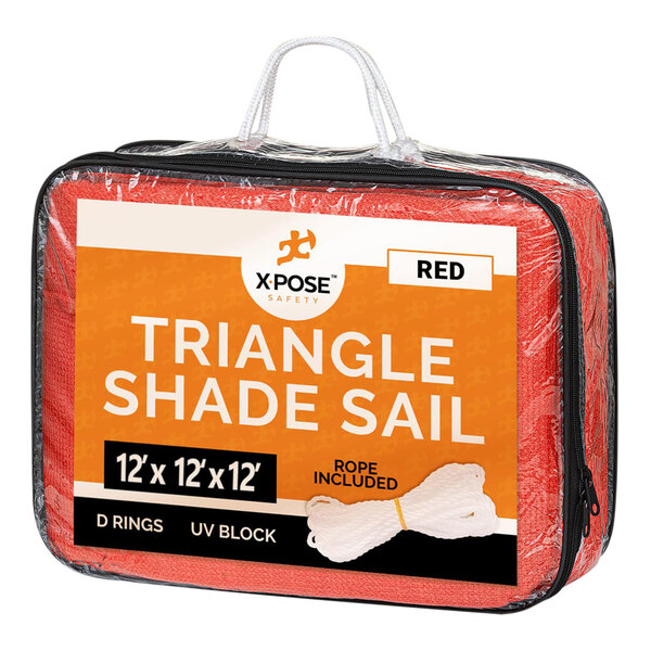 A red triangular Xpose Safety shade sail in a bag.