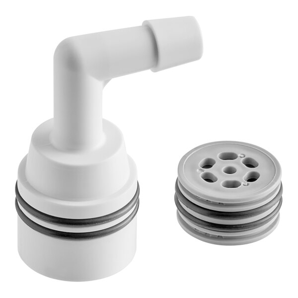 A white plastic circular object with black rings on the edge.