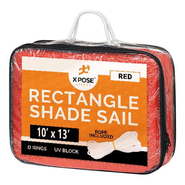 A red rectangular Xpose Safety shade sail in a plastic bag.