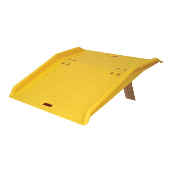 A yellow plastic board with holes.