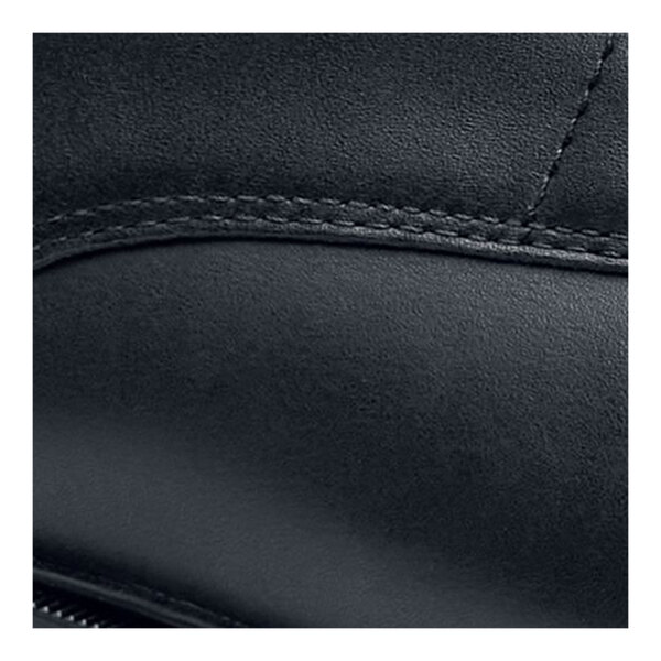 The side of a black leather Shoes For Crews Senator dress shoe.