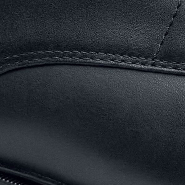 A side view of a black leather Shoes For Crews Senator shoe.
