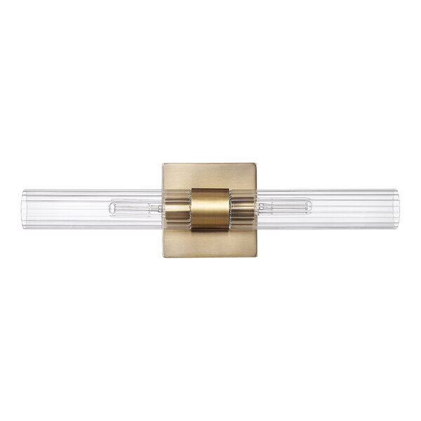 A Globe matte brass vanity light with clear cylindrical glass shades.