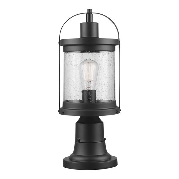 A black Globe post mount lantern with clear seeded glass shade.