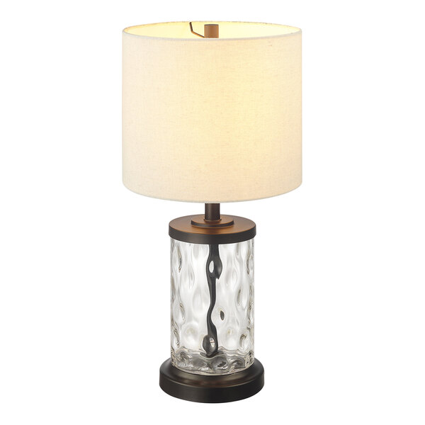 A Globe oil-rubbed bronze table lamp with a fillable watered glass base and a white shade.