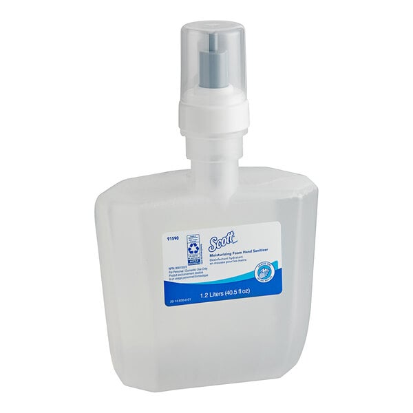 A clear plastic bottle of Scott Moisturizing Foaming Hand Sanitizer with a spray pump.