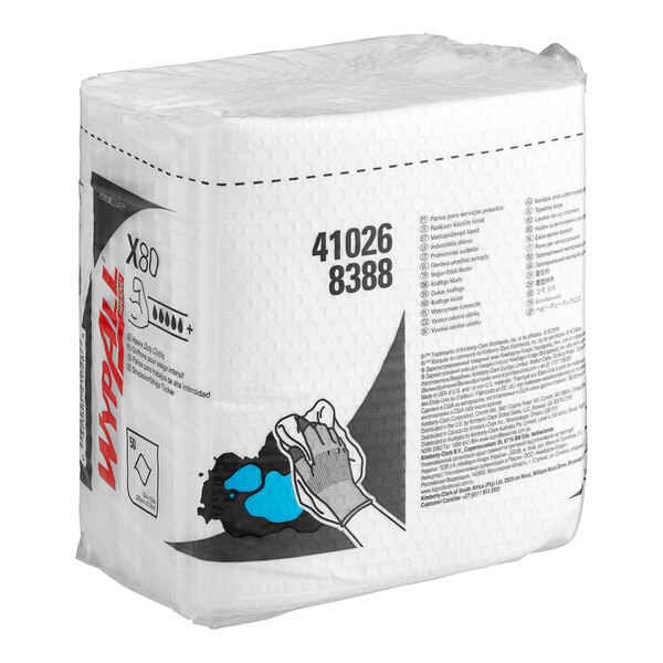 A white package of WypAll X80 white heavy-duty wipers with blue and white dots.