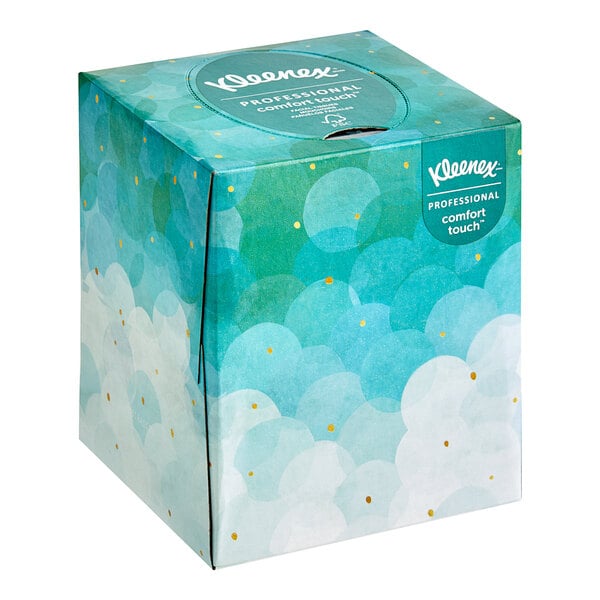 A Kleenex tissue box with blue and white clouds.