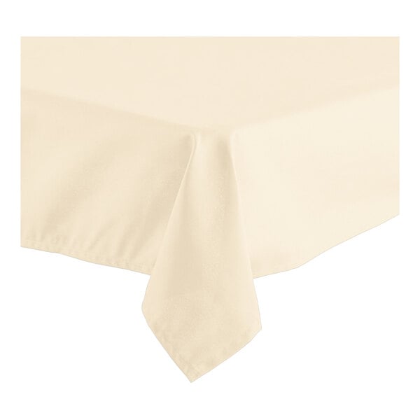 A close-up of a folded ivory rectangular table cover with a hemmed edge.