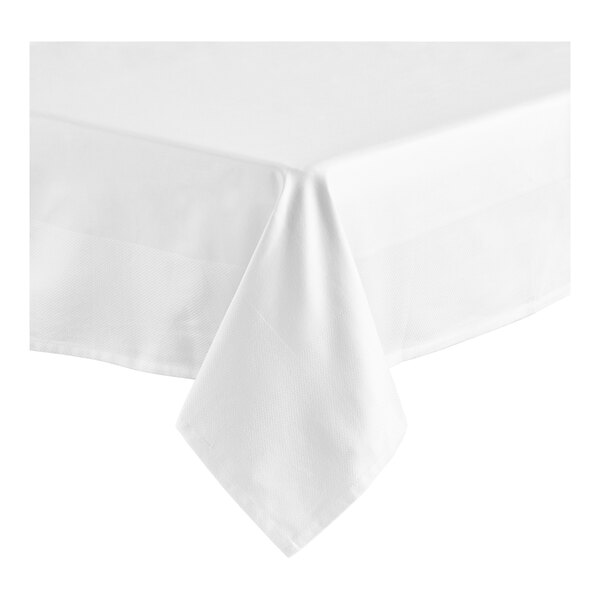A white Oxford square table cover on a table.